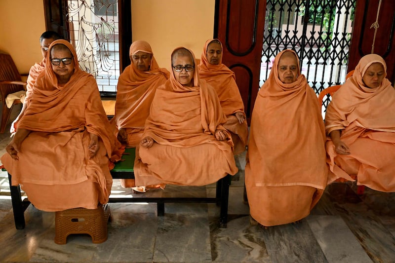 Hindu anchorites practise yoga to mark the day at an ashram near Kolkata. AFP