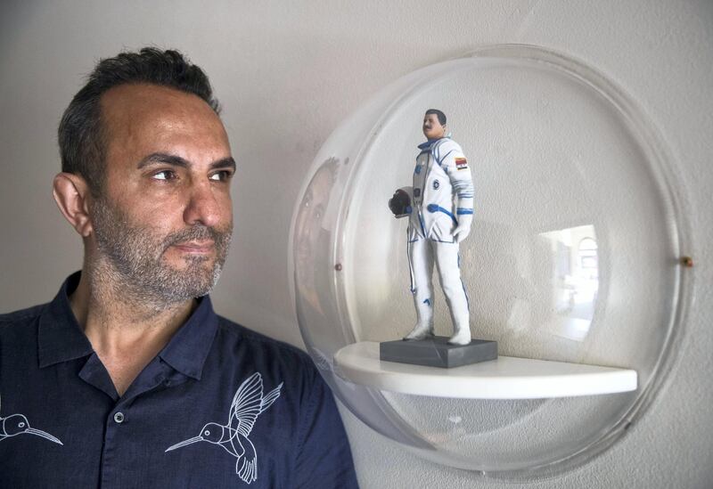 LONDON 6th July 2018. Artist Halil Altindere with a his Mini Faris sculpture of Syrian Cosmonaut Muhammed Ahmed Faris  at the Space Refugee exhibition at the British Interplanetary Society in London. Stephen Lock for the National 