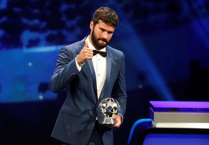 Liverpool's Alisson with the Goalkeeper of the Season award. Reuters