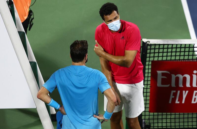 DUBAI, UNITED ARAB EMIRATES - MARCH 14: Jo-Wilfried Tsonga of France looks on after picking up an injury, forcing him to withdraw from the Round One match against Malek Jaziri of Tunisia during Day Eight of the Dubai Duty Free Tennis at Dubai Duty Free Tennis Stadium on March 14, 2021 in Dubai, United Arab Emirates. (Photo by Francois Nel/Getty Images)
