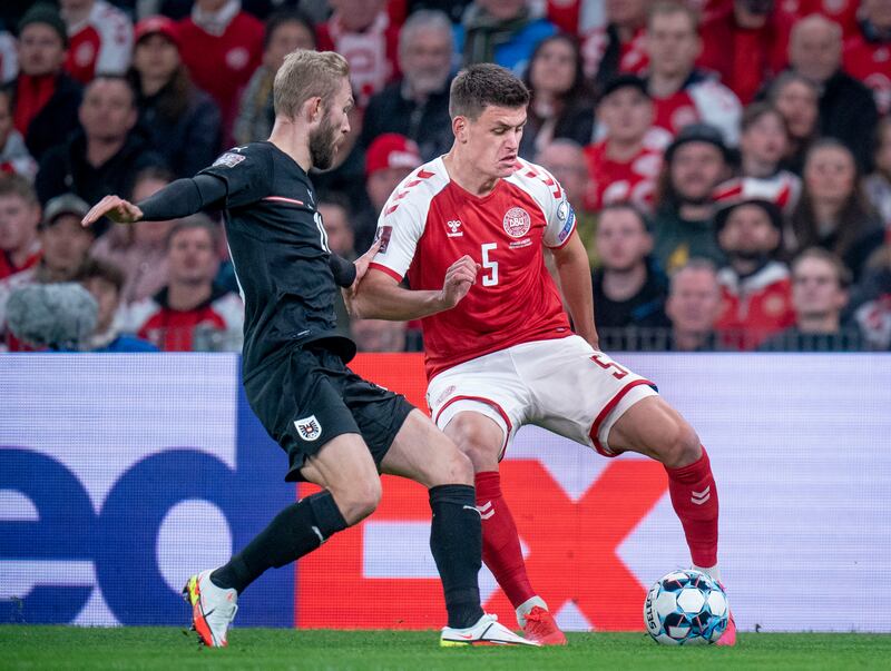 Denmark's Joakim Maehle, right,  in possession during his team's 1-0 win over Austria in the World Cup qualifying match at Parken Stadium in Copenhagen, on Tuesday, October 12. AP