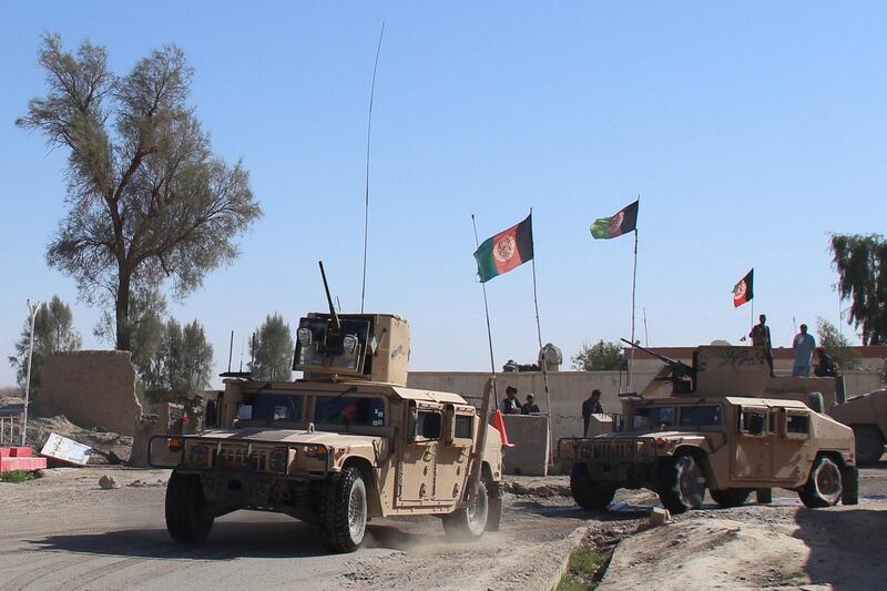 Afghan security forces patrol on the outskirts of Helmand, on January 17, 2021. Violence has surged across the country in recent weeks, despite the Afghan government and the Taliban committing to reduce their attacks. EPA