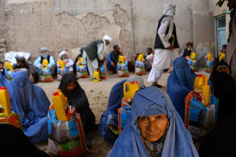 Afghan women receive aid from Zakat during Ramdan in Herat province. Hoshang Hashimi / AFP