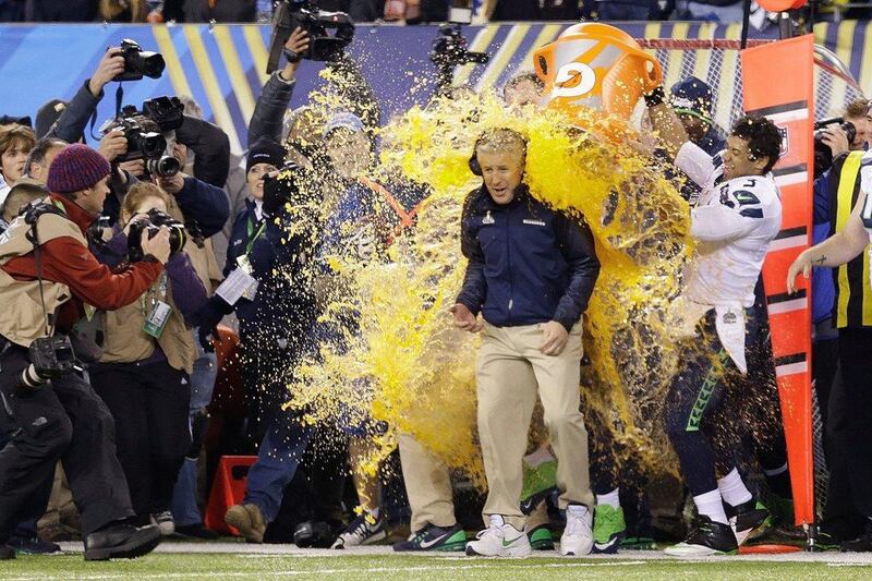 The Seahawks pour Gatorade over coach Pete Carroll as time expires and Seattle win the Super Bowl on Sunday. Julio Cortez / AP 