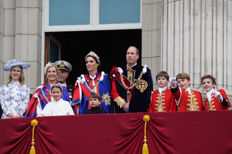 Prince William and his wife Kate, and other royals including their three children, on the balcony at Buckingham Palace after the coronation. Getty