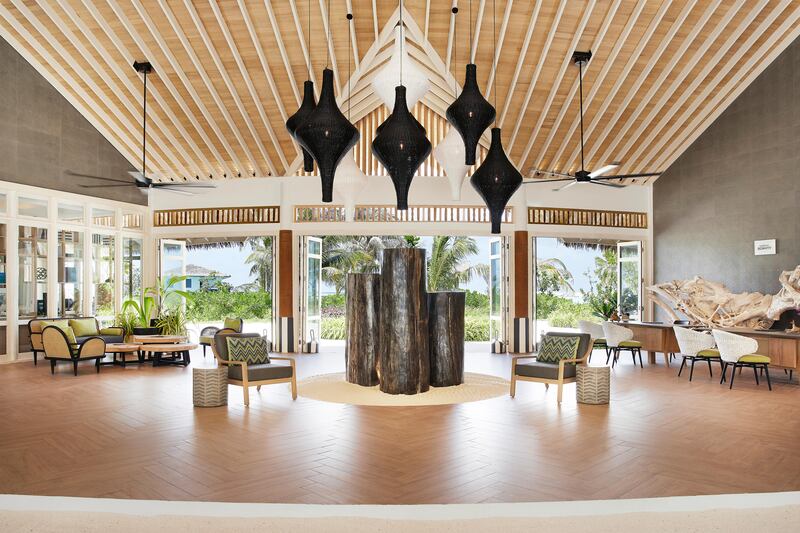 The reception area of Le Meridien Maldives Resort & Spa is an open space, called the Hub.