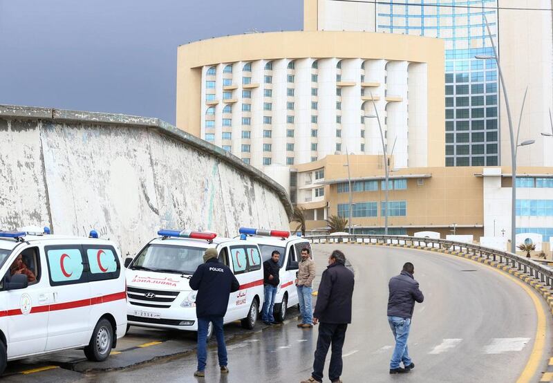 Libyan security forces and emergency services surround Tripoli's central Corinthia Hotel on January 27. AFP Photo

