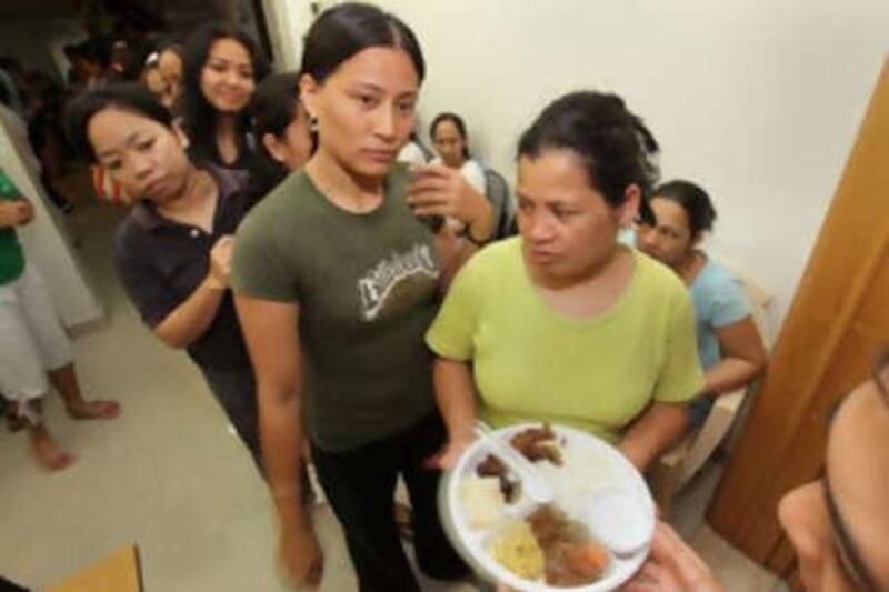 Women stranded in the UAE and sheltered at the Filipino Workers Resource Centre at the Philippine overseas labour office in Dubai share the iftar meal.