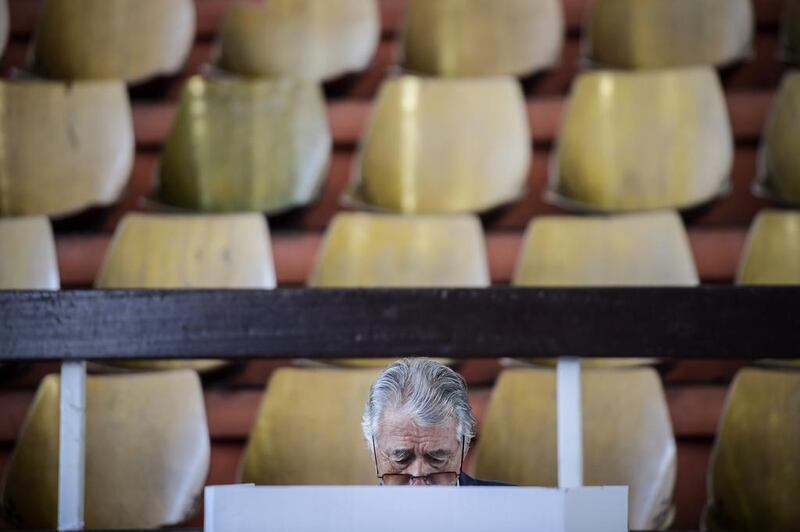 A man votes at a polling station in Pristina, Kosovo. Armend Nimani / AFP Photo
