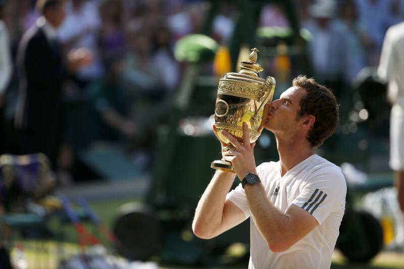 Great Britain's Andy Murray celebrates with the trophy after defeating Serbia's Novak Djokovic in the Men's Final during day thirteen of the Wimbledon Championships at The All England Lawn Tennis and Croquet Club, Wimbledon.   (Photo by Jonathan Brady/PA Images via Getty Images)