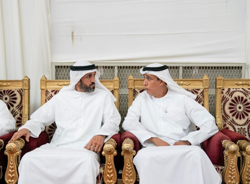 SHAWAMEKH, ABU DHABI, UNITED ARAB EMIRATES - September 15, 2019: HE Mohamed Mubarak Al Mazrouei, Undersecretary of the Crown Prince Court of Abu Dhabi (L) and HE Jaber Al Suwaidi, General Director of the Crown Prince Court - Abu Dhabi (R), offer condolences to the family of martyr Warrant Officer Zayed Musllam Suhail Al Amri.

( Mohamed Al Hammadi / Ministry of Presidential Affairs )
---