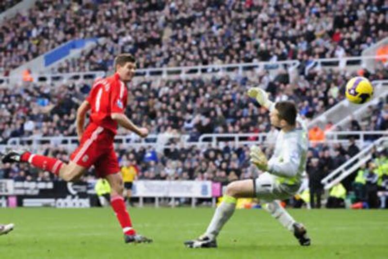 The Liverpool captain Steven Gerrard lobs the ball over the advancing Shay Given in the Newcastle goal for his second and Liverpool's fourth.