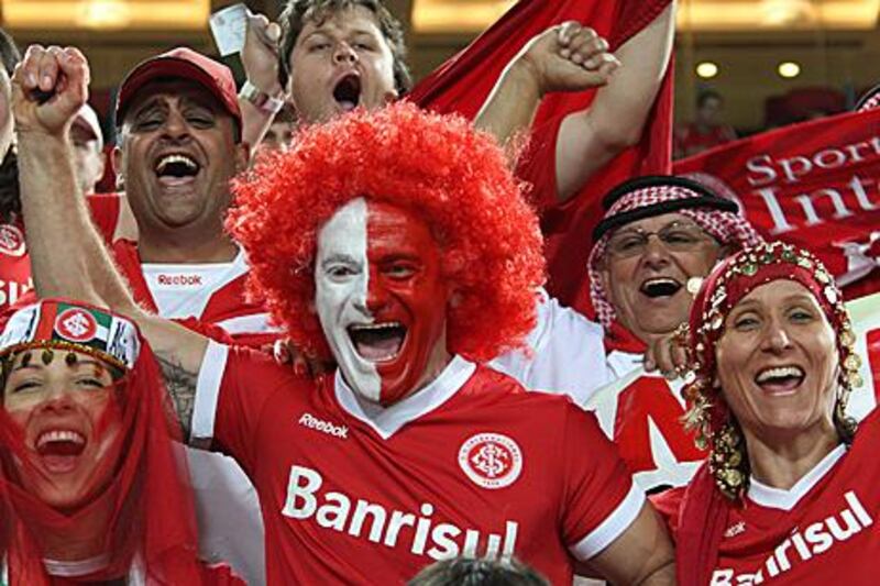 SC Internacional fans make noise during their match against TP Mazembe.