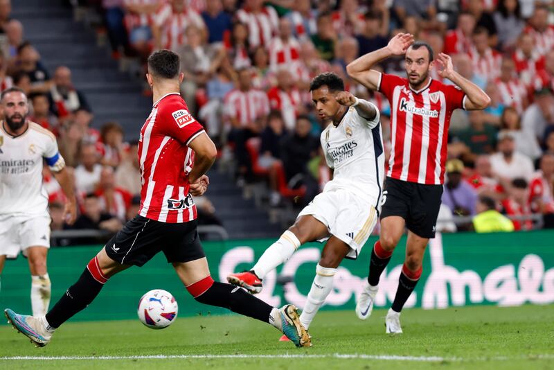 Rodrygo shoots to score Real Madrid's opening goal against Athletic Bilbao. EPA