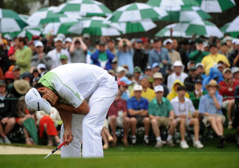 Jason Day of Australia reacts after missing a putt on the 18th hole during the fourth round of the 77th Masters golf tournament at Augusta National Golf Club on April 14, 2013 in Augusta, Georgia.  AFP PHOTO /  JIM WATSON
 *** Local Caption ***  911857-01-08.jpg