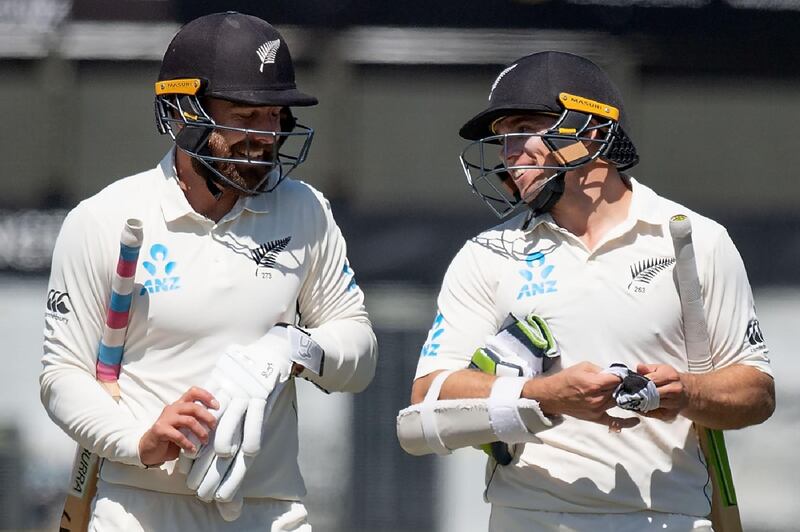 New Zealand's Tom Latham (R) and teammate Tom Blundell (L) walk from the field after their win. AFP