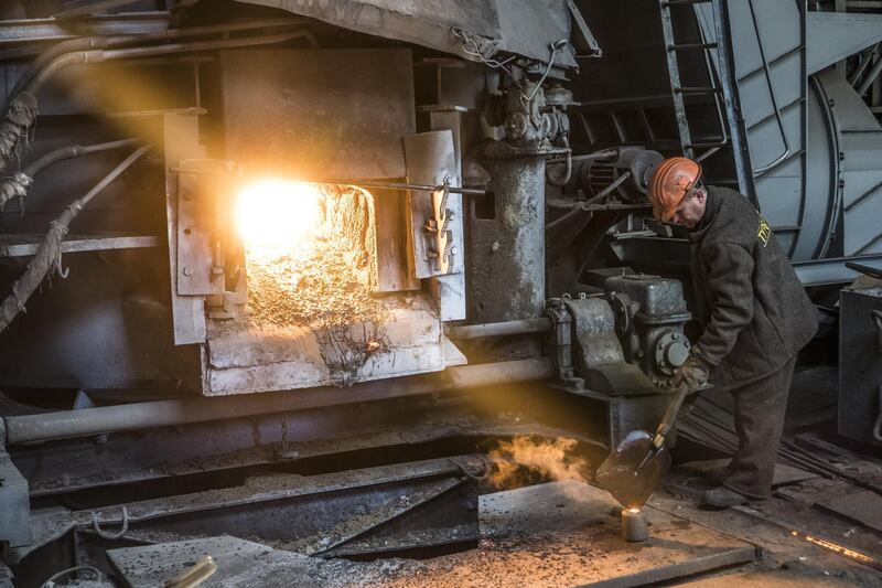A worker attends to a furnace during steel manufacture at the Turboatom OJSC plant in Kharkiv, Ukraine, on Friday, June 22, 2018. Turboatom OJSC is a power machine building complex, specializing in the production of steam turbines for electric power stations, gas, hydraulic and small steam turbines and hydraulic shutters of different types. Photographer: Vincent Mundy/Bloomberg
