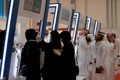 ABU DHABI - UNITED ARAB EMIRATES - 03FEB2014 - Visitors being briefed for jobs at Mubadala stall at Emiratisation recruitment fair at yesterday Abu Dhabi National Exhibition Centre. Ravindranath K / The National (to go with Jennifer Bell story for Nation) 