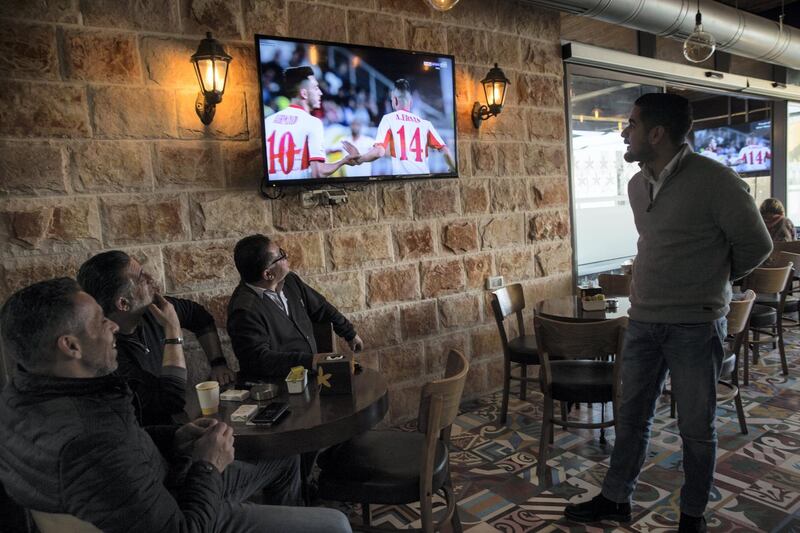 Palestinians  as they watch Palestine play Jordan in the Asia Cup 2018 held in Abu Dhabi as they sit in the Jasmine Cafe in the West Bank City of Nablus on January 15,2018. The game was a tie 0-0 .(Photo by Heidi Levine for The National).