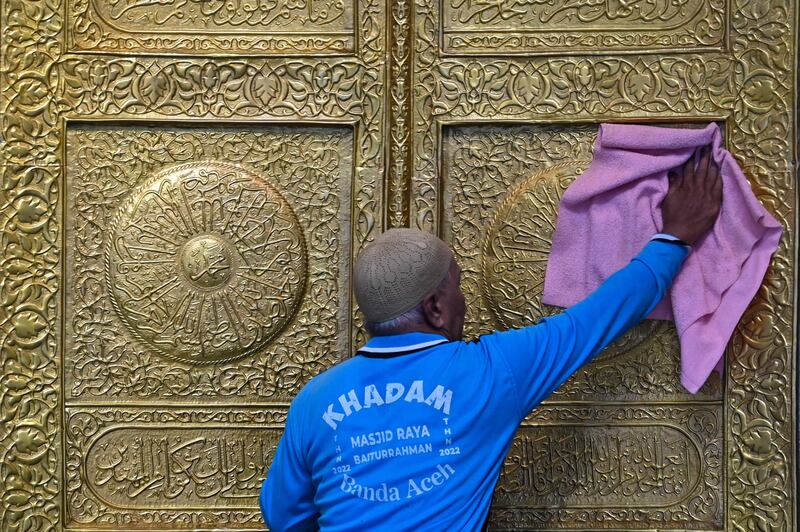 A worker cleans part of the Baiturrahman Grand Mosque ahead of Ramadan, in Banda Aceh, Indonesia. AFP