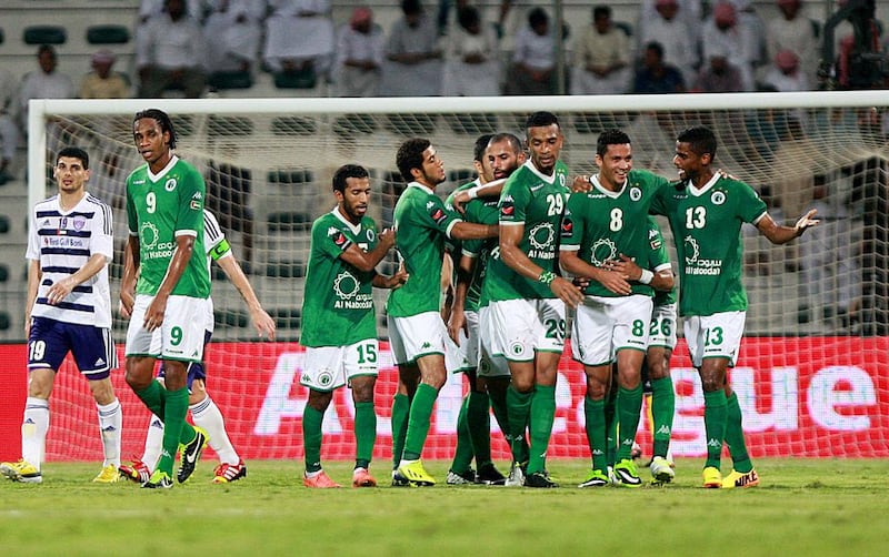Al Shabab, in green, were dominant against Al Ain on Sunday night. Satish Kumar / The National