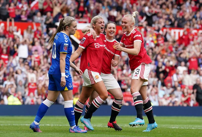 Alessia Russo celebrates with team-mates after scoring the third goal at Old Trafford. PA