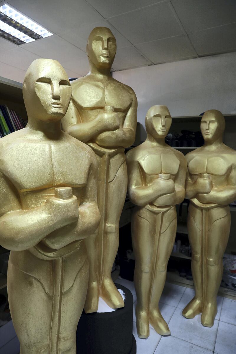 Dubai, United Arab Emirates - January 10th, 2018: Photo project. Sculptor Mark Ranasinghe applies the final touches to his giant oscar sculptures made out of polystyrene. Wednesday, January 10th, 2018 at Al Quoz, Dubai. Chris Whiteoak / The National