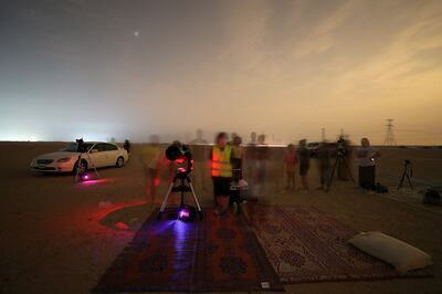 DUBAI, UNITED ARAB EMIRATES , August 13 – 2020 :- People watching the Perseid meteor shower at the Al Qudra desert area in Dubai. The event was organized by Dubai Astronomy Group with all the precaution against Covid 19 such as safe distance between the families and mask was mandatory. The event started on August 12 at 10pm to 2am on August 13.  (Pawan Singh / The National) For News/Standalone/Online/Instagram/Big Picture