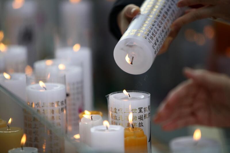 South Koreans pray for their children taking the college entrance exam at temple in Seoul, South Korea. Getty Images