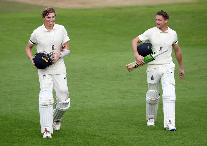 England's Zak Crawley, left, and Jos Buttler at the end of day one. AP