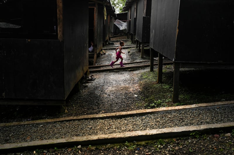 A Venezuelan migrant child runs through a temporary camp after walking across the Darien Gap from Colombia, in Lajas Blancas, Panama. AP Photo 