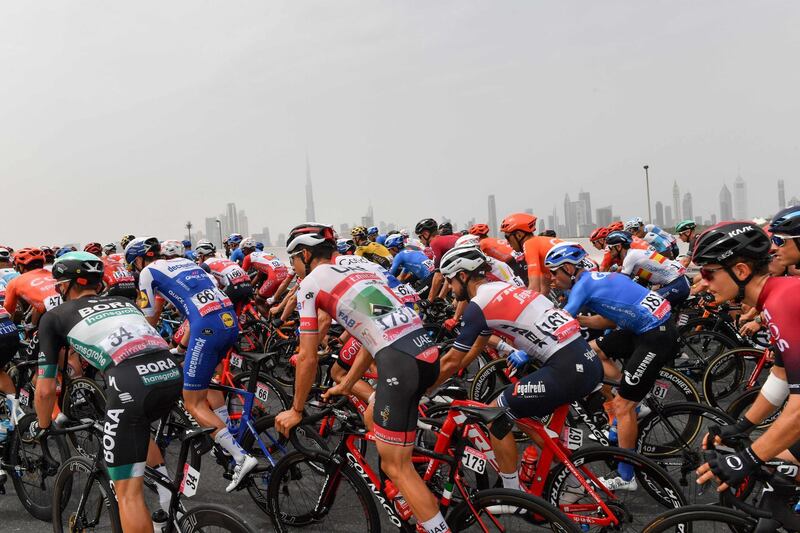 Cyclists ride during stage four of the UAE Tour. AFP