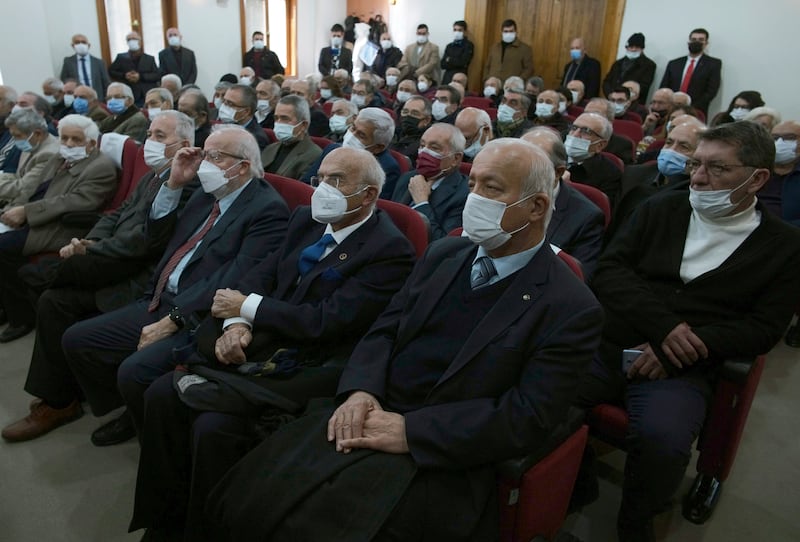 Audience members wear protective masks during a lecture in Ankara, Turkey. AP