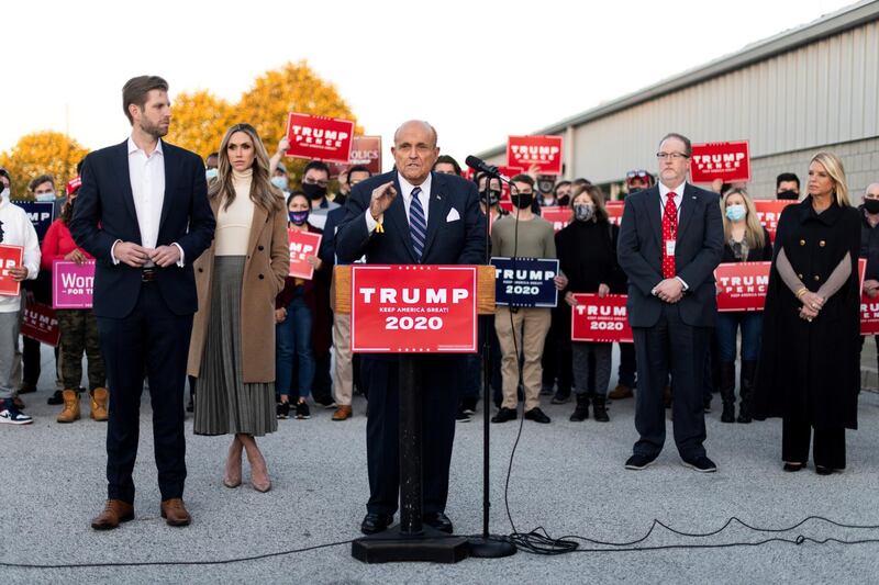 Former New York City Mayor Rudy Giuliani, personal attorney to US. President Donald Trump, speaks near Eric Trump and his wife Lara Trump, Trump campaign ballot counting observer Jeremy Mercer, and former Florida Attorney General Pam Bondi during a news conference held to discuss election-related lawsuits at Atlantic Aviation PHL private air terminal in Philadelphia, Pennsylvania. Reuters