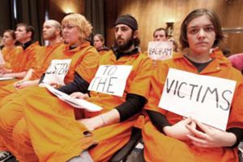 University students, wearing jumpsuits that symbolise rights abuse, attend a Senate committee hearing on a "truth commission".