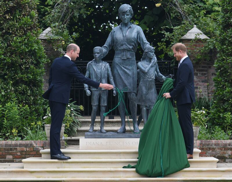 Prince William and Prince Harry unveil a statue they commissioned of their mother Princess Diana in the Sunken Garden at Kensington Palace, in July 2021. Getty Images