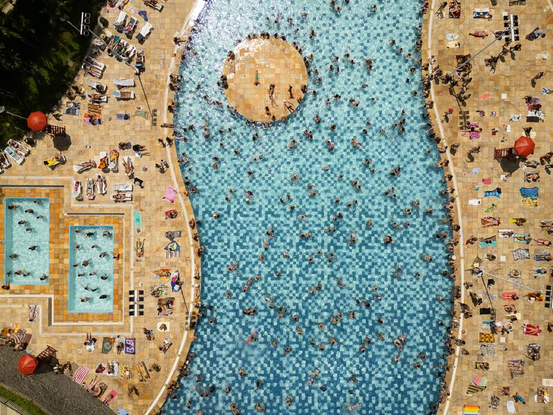 People sunbathing at Sesc Belenzinho swimming pools near Sao Paulo, Brazil. EPA