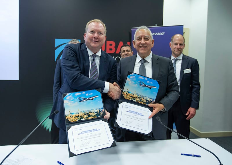 Stanley Deal, president and chief executive of Boeing Commercial Airplanes, left, and Samer Majali, chief executive of Royal Jordanian Airlines, at a signing ceremony during the Dubai Airshow on Monday. Leslie Pableo / The National