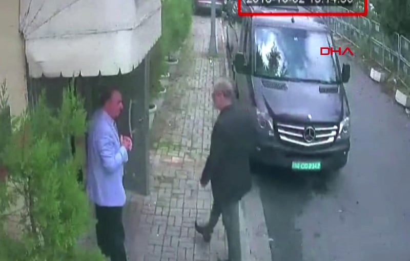 This video grab made on October 10, 2018 from CCTV footage obtained from Turkish news agency DHA shows Saudi journalist Jamal Khashoggi (R) arriving at the Saudi Arabian consulate in Istanbul on October 2, 2018 - Khashoggi, a Washington Post contributor, vanished on October 2 after entering the consulate to obtain official documents ahead of his marriage to his Turkish fiancee. Government sources said at the weekend that police believed Khashoggi was killed by a team specially sent to Istanbul, thought to consist of 15 Saudis. But Riyadh insisted the 59-year-old journalist had left the building and the murder claims were "baseless". (Photo by - / Demiroren News Agency / AFP) / - Turkey OUT / RESTRICTED TO EDITORIAL USE - MANDATORY CREDIT "AFP PHOTO / DHA" - NO MARKETING NO ADVERTISING CAMPAIGNS - DISTRIBUTED AS A SERVICE TO CLIENTS