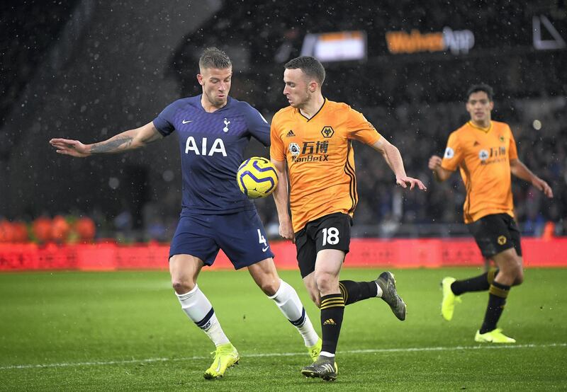 WOLVERHAMPTON, ENGLAND - DECEMBER 15: Toby Alderweireld of Tottenham Hotspur battles for possession with Diogo Jota of Wolverhampton Wanderers during the Premier League match between Wolverhampton Wanderers and Tottenham Hotspur at Molineux on December 15, 2019 in Wolverhampton, United Kingdom. (Photo by Michael Regan/Getty Images)