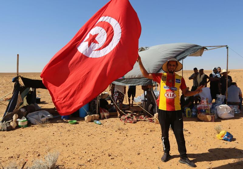 Protestors stage a sit-in outside the oil and gas plant in El Kamour, in Tunisia's southern state of Tatatouine, demanding for a share of the resources and employment in the sector.  AFP