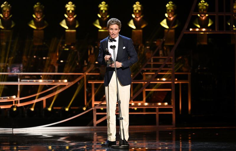 Eddie Redmayne accepts the award for Best Actor in a Musical. Getty Images