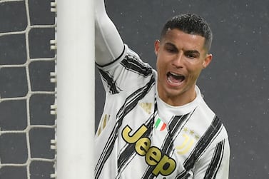 Juventus' Portuguese forward Cristiano Ronaldo celebrates after Roma scored an own goal during the Italian Serie A football match Juventus vs AS Roma on February 6, 2021 at the Juventus stadium in Turin. / AFP / Isabella BONOTTO