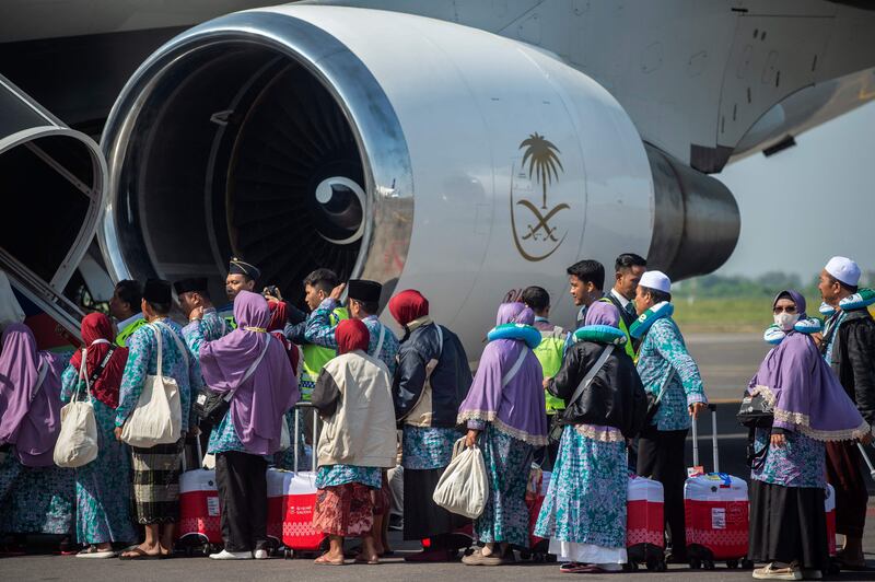 Indonesian pilgrims in Sidoarjo board a plane to take them on their Hajj journey. AFP