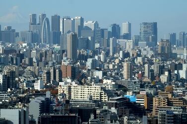 Tokyo's Shinjuku area. Japanese people earn less than their US counterparts but gain in other ways. AFP