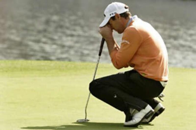 The English golfer Oliver Wilson looks dejected after missing a putt on the 18th hole during the play-off of the HSBC Champions tournament in Shanghai.