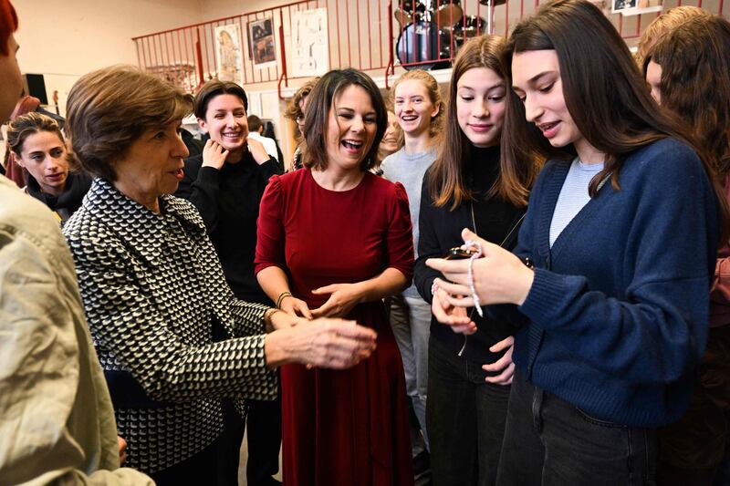 Foreign ministers Catherine Colonna of France, left, and Annalena Baerbock of Germany, second left, met pupils at a school in Paris. AFP