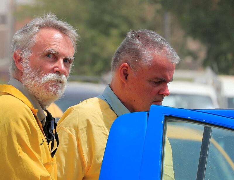 Jim Fitton from Britain and Volker Waldmann from Germany outside a court in Baghdad, Iraq. Reuters