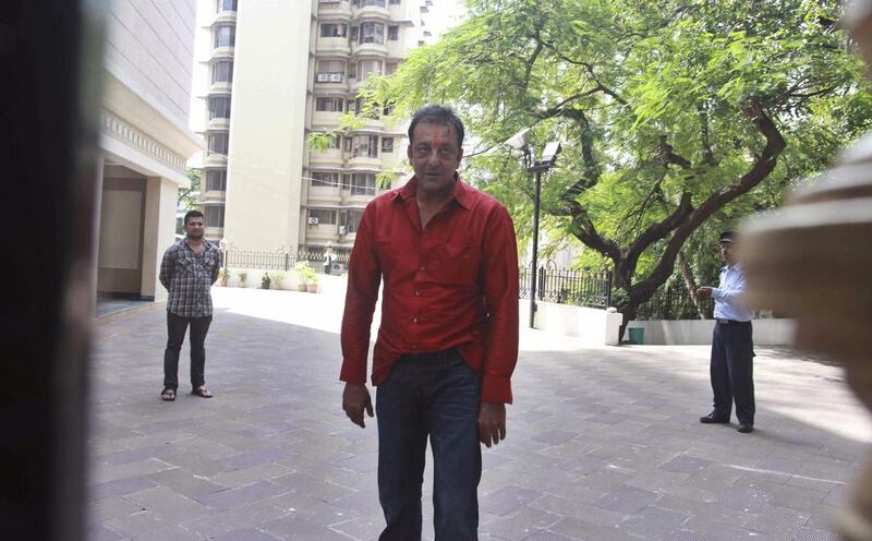 The Bollywood actor Sanjay Dutt stands outside his home after being temporally freed for two weeks from an Indian prison. AP Photo