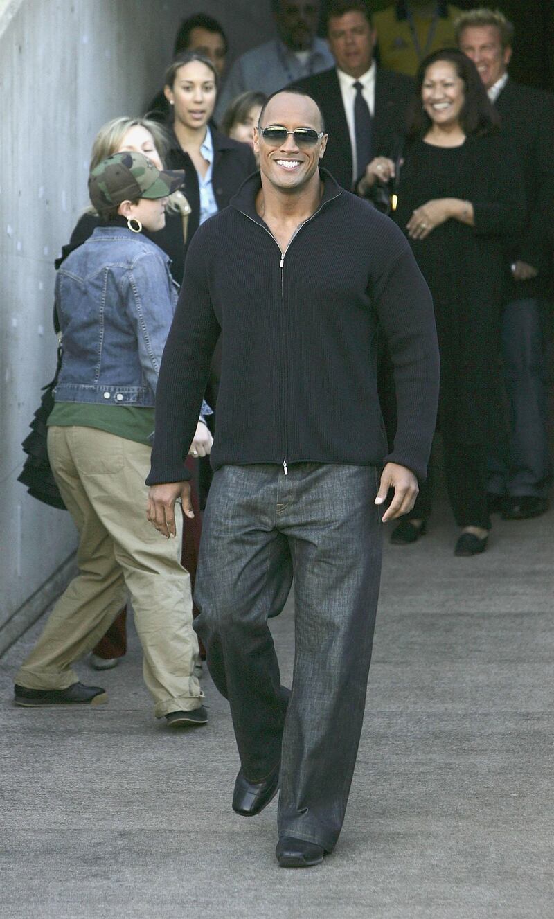 SYDNEY, AUSTRALIA- AUGUST 5:  Actor Dwayne Johnson "The Rock" arrives to receive the Australian Rugby League official "Kangaroo" Jersey from a selection of national players at the Aussie Stadium on August 5, 2004 in Sydney, Australia. (Photo by Patrick Riviere/Getty Images)